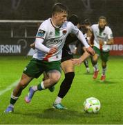 18 April 2025; Cathal O'Sullivan of Cork City in action against Jordan Flores of Bohemians during the SSE Airtricity Men's Premier Division match between Bohemians and Cork City at Dalymount Park in Dublin. Photo by Thomas Gallagher/Sportsfile