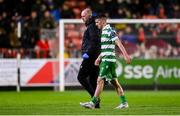 18 April 2025; Dylan Watts of Shamrock Rovers leaves the pitch with Shamrock Rovers physiotherapist Tony McCarthy to receive further medical attention during the SSE Airtricity Men's Premier Division match between St Patrick's Athletic and Shamrock Rovers at Richmond Park in Dublin. Photo by Stephen McCarthy/Sportsfile