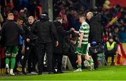 18 April 2025; Dylan Watts of Shamrock Rovers leaves the pitch with Shamrock Rovers physiotherapist Tony McCarthy to receive further medical attention as he is also consoled by Shamrock Rovers manager Stephen Bradley during the SSE Airtricity Men's Premier Division match between St Patrick's Athletic and Shamrock Rovers at Richmond Park in Dublin. Photo by Stephen McCarthy/Sportsfile