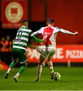 18 April 2025; Chris Forrester of St Patrick's Athletic in action against Graham Burke of Shamrock Rovers during the SSE Airtricity Men's Premier Division match between St Patrick's Athletic and Shamrock Rovers at Richmond Park in Dublin. Photo by Stephen McCarthy/Sportsfile