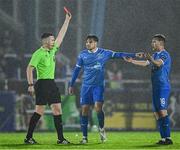 18 April 2025; Referee Aaron O'Dowd shows a red card to Kyle White of Waterford, right, during the SSE Airtricity Men's Premier Division match between Waterford and Sligo Rovers at the Regional Sports Centre in Waterford. Photo by Seb Daly/Sportsfile