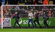 18 April 2025; St Patrick's Athletic supporters run onto the pitch as Joe Redmond of St Patrick's Athletic scores their side's second goal during the SSE Airtricity Men's Premier Division match between St Patrick's Athletic and Shamrock Rovers at Richmond Park in Dublin. Photo by Stephen McCarthy/Sportsfile