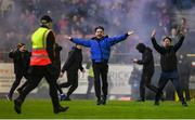 18 April 2025; St Patrick's Athletic supporters run onto the pitch as Joe Redmond of St Patrick's Athletic scores their side's second goal during the SSE Airtricity Men's Premier Division match between St Patrick's Athletic and Shamrock Rovers at Richmond Park in Dublin. Photo by Stephen McCarthy/Sportsfile
