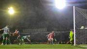 18 April 2025; Joe Redmond of St Patrick's Athletic, left, heads to score his side's second goal during the SSE Airtricity Men's Premier Division match between St Patrick's Athletic and Shamrock Rovers at Richmond Park in Dublin. Photo by Stephen McCarthy/Sportsfile