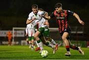 18 April 2025; James Clarke of Bohemians in action against Darragh Crowley of Cork City during the SSE Airtricity Men's Premier Division match between Bohemians and Cork City at Dalymount Park in Dublin. Photo by Shauna Clinton/Sportsfile