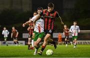 18 April 2025; James Clarke of Bohemians in action against Darragh Crowley of Cork City during the SSE Airtricity Men's Premier Division match between Bohemians and Cork City at Dalymount Park in Dublin. Photo by Shauna Clinton/Sportsfile