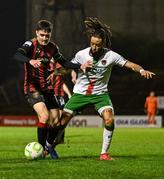 18 April 2025; Dawson Devoy of Bohemians in action against Milan Mbeng of Cork City during the SSE Airtricity Men's Premier Division match between Bohemians and Cork City at Dalymount Park in Dublin. Photo by Shauna Clinton/Sportsfile
