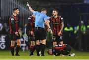 18 April 2025; Referee Paul McLaughlin speaks to Ross Tierney of Bohemians after he was pushed by Cathal O'Sullivan of Cork City, not pictured, during the SSE Airtricity Men's Premier Division match between Bohemians and Cork City at Dalymount Park in Dublin. Photo by Shauna Clinton/Sportsfile