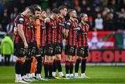 18 April 2025; Bohemians players observe a minute's silence in honour of late player, manager and life-long club member Billy Young before the SSE Airtricity Men's Premier Division match between Bohemians and Cork City at Dalymount Park in Dublin. Photo by Shauna Clinton/Sportsfile