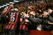 18 April 2025; Bohemians supporters congratulate players after James McManus, hidden, pictures their side's first goal during the SSE Airtricity Men's Premier Division match between Bohemians and Cork City at Dalymount Park in Dublin. Photo by Shauna Clinton/Sportsfile