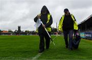19 April 2025; Groundsmen Frankie Lyons, left, and Martin Keane prepare the sideline flags before the Munster GAA Football Senior Championship semi-final match between Clare and Tipperary at Zimmer Biomet Cusack Park in Ennis, Clare. Photo by Tom Beary/Sportsfile