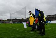 19 April 2025; Groundsmen Martin Keane, left and Frankie Lyons prepare the sideline flags before the Munster GAA Football Senior Championship semi-final match between Clare and Tipperary at Zimmer Biomet Cusack Park in Ennis, Clare. Photo by Tom Beary/Sportsfile