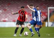 19 April 2025; Roy Kenny of Ringmahon Rangers FC in action against Killian Cooper of College Corinthians AFC during the FAI Intermediate Cup final match between College Corinthians AFC and Ringmahon Rangers FC at Turners Cross Stadium in Cork. Photo by Michael P Ryan/Sportsfile