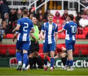 19 April 2025; Adam Walsh of College Corinthians AFC is shown a red card by referee Declan Troy during the FAI Intermediate Cup final match between College Corinthians AFC and Ringmahon Rangers FC at Turners Cross Stadium in Cork. Photo by Michael P Ryan/Sportsfile