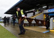 19 April 2025; Groundsmen Martin Keane, left, and Frankie Lyons bring out the bench ahead of the team photographs before the Munster GAA Football Senior Championship semi-final match between Clare and Tipperary at Zimmer Biomet Cusack Park in Ennis, Clare. Photo by Tom Beary/Sportsfile