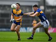 19 April 2025; Brian McNamara of Clare in action against Ben Commerford of Tipperary during the Munster GAA Football Senior Championship semi-final match between Clare and Tipperary at Zimmer Biomet Cusack Park in Ennis, Clare. Photo by Tom Beary/Sportsfile
