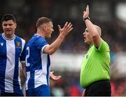 19 April 2025; Ian Turner of College Corinthians AFC remonstrates with referee Declan Troy during the FAI Intermediate Cup final match between College Corinthians AFC and Ringmahon Rangers FC at Turners Cross Stadium in Cork. Photo by Michael P Ryan/Sportsfile