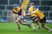 19 April 2025; Charlie McGuckin of Wexford in action against Eoghan Campbell and Scott Walsh of Antrim during the Leinster GAA Hurling Senior Championship Round 1 match between Wexford and Antrim at Chadwicks Wexford Park in Wexford. Photo by Matt Browne/Sportsfile