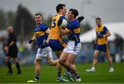 19 April 2025; Jack Harney of Tipperary is tackled by Mark McInerney of Clare during the Munster GAA Football Senior Championship semi-final match between Clare and Tipperary at Zimmer Biomet Cusack Park in Ennis, Clare. Photo by Tom Beary/Sportsfile
