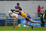 19 April 2025; Micheal Freaney of Tipperary is blocked down by Cillian Rouine of Clare during the Munster GAA Football Senior Championship semi-final match between Clare and Tipperary at Zimmer Biomet Cusack Park in Ennis, Clare. Photo by Tom Beary/Sportsfile