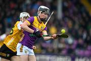19 April 2025; Eoin Ryan of Wexford in action against Seann Elliot of Antrim during the Leinster GAA Hurling Senior Championship Round 1 match between Wexford and Antrim at Chadwicks Wexford Park in Wexford. Photo by Matt Browne/Sportsfile