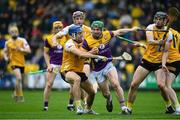 19 April 2025; Kevin Foley of Wexford in action against Stephen Rooney and Gerard Walsh of Antrim during the Leinster GAA Hurling Senior Championship Round 1 match between Wexford and Antrim at Chadwicks Wexford Park in Wexford. Photo by Matt Browne/Sportsfile