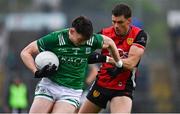 19 April 2025; Oisin Smyth of Fermanagh in action against Pat Havern of Down during the Ulster GAA Football Senior Championship quarter-final match between Fermanagh and Down at Brewster Park in Enniskillen, Fermanagh. Photo by Ramsey Cardy/Sportsfile