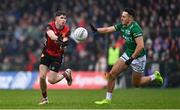 19 April 2025; John McGeough of Down in action against Fionan O'Brien of Fermanagh during the Ulster GAA Football Senior Championship quarter-final match between Fermanagh and Down at Brewster Park in Enniskillen, Fermanagh. Photo by Ramsey Cardy/Sportsfile