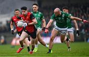 19 April 2025; James Guinness of Down in action against Ché Cullen of Fermanagh during the Ulster GAA Football Senior Championship quarter-final match between Fermanagh and Down at Brewster Park in Enniskillen, Fermanagh. Photo by Ramsey Cardy/Sportsfile