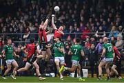 19 April 2025; Odhran Murdock, left, and James Guinness of Down in action against Joe McDade of Fermanagh during the Ulster GAA Football Senior Championship quarter-final match between Fermanagh and Down at Brewster Park in Enniskillen, Fermanagh. Photo by Ramsey Cardy/Sportsfile