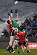 19 April 2025; Joe McDade of Fermanagh in action against Odhran Murdock of Down during the Ulster GAA Football Senior Championship quarter-final match between Fermanagh and Down at Brewster Park in Enniskillen, Fermanagh. Photo by Ramsey Cardy/Sportsfile