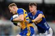 19 April 2025; Rory McMahon of Clare is tackled by Darragh Brennan of Tipperary during the Munster GAA Football Senior Championship semi-final match between Clare and Tipperary at Zimmer Biomet Cusack Park in Ennis, Clare. Photo by Tom Beary/Sportsfile