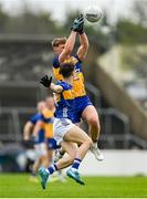 19 April 2025; Dermot Coughlan of Clare in action against Jack O'Neill of Tipperary during the Munster GAA Football Senior Championship semi-final match between Clare and Tipperary at Zimmer Biomet Cusack Park in Ennis, Clare. Photo by Tom Beary/Sportsfile