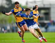 19 April 2025; Darragh Brennan of Tipperary is tackled by Ronan Lanigan of Clare during the Munster GAA Football Senior Championship semi-final match between Clare and Tipperary at Zimmer Biomet Cusack Park in Ennis, Clare. Photo by Tom Beary/Sportsfile