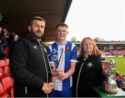 19 April 2025; FAI vice-president John Finnegan presents the player of the match award to Eric Cunningham of College Corinthians AFC in the presence of FAI board member Ursula Scully after the FAI Intermediate Cup final match between College Corinthians AFC and Ringmahon Rangers FC at Turners Cross Stadium in Cork. Photo by Michael P Ryan/Sportsfile