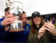 19 April 2025; College Corinthians AFC manager Gary Hackett with the cup poses for a picture with a supporter after the FAI Intermediate Cup final match between College Corinthians AFC and Ringmahon Rangers FC at Turners Cross Stadium in Cork. Photo by Michael P Ryan/Sportsfile