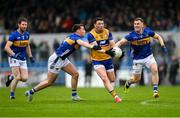 19 April 2025; Keelan Sexton of Clare is tackled by Jack Harney, left, and Jason Madigan of Tipperary during the Munster GAA Football Senior Championship semi-final match between Clare and Tipperary at Zimmer Biomet Cusack Park in Ennis, Clare. Photo by Tom Beary/Sportsfile