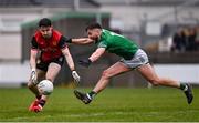 19 April 2025; James Guinness of Down in action against Ryan Lyons of Fermanagh during the Ulster GAA Football Senior Championship quarter-final match between Fermanagh and Down at Brewster Park in Enniskillen, Fermanagh. Photo by Ramsey Cardy/Sportsfile