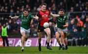 19 April 2025; Odhran Murdock of Down in action against Conor McGee, left, and Ryan Lyons of Fermanagh during the Ulster GAA Football Senior Championship quarter-final match between Fermanagh and Down at Brewster Park in Enniskillen, Fermanagh. Photo by Ramsey Cardy/Sportsfile