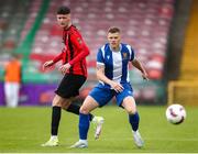 19 April 2025; Ian Turner of College Corinthians AFC in action against Adam Delurey during the FAI Intermediate Cup final match between College Corinthians AFC and Ringmahon Rangers FC at Turners Cross Stadium in Cork. Photo by Michael P Ryan/Sportsfile