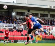 19 April 2025; Eric Cunningham of College Corinthians AFC has a header on goal despite the attention of Christopher McCarthy of Ringmahon Rangers FC during the FAI Intermediate Cup final match between College Corinthians AFC and Ringmahon Rangers FC at Turners Cross Stadium in Cork. Photo by Michael P Ryan/Sportsfile