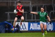 19 April 2025; John McGeough of Down in action against Fionan O'Brien of Fermanagh during the Ulster GAA Football Senior Championship quarter-final match between Fermanagh and Down at Brewster Park in Enniskillen, Fermanagh. Photo by Ramsey Cardy/Sportsfile