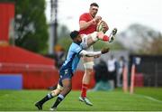 19 April 2025; Tom Ahern of Munster is tackled by Canan Moodie of Vodacom Bulls during the United Rugby Championship match between Munster and Vodacom Bulls at Thomond Park in Limerick. Photo by David Fitzgerald/Sportsfile