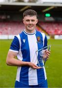 19 April 2025; Eric Cunningham of College Corinthians AFC with his player of the match award after the FAI Intermediate Cup final match between College Corinthians AFC and Ringmahon Rangers FC at Turners Cross Stadium in Cork. Photo by Michael P Ryan/Sportsfile