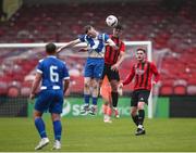 19 April 2025; Killian Cooper of College Corinthians AFC in action against Christopher McCarthy of Ringmahon Rangers FC during the FAI Intermediate Cup final match between College Corinthians AFC and Ringmahon Rangers FC at Turners Cross Stadium in Cork. Photo by Michael P Ryan/Sportsfile