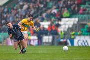 19 April 2025; Jordan Flynn of Mayo is tackled by Barry McNulty of Leitrim during the Connacht GAA Football Senior Championship semi-final match between Leitrim and Mayo at Avant Money Páirc Seán Mac Diarmada in Carrick-on-Shannon, Leitrim. Photo by Thomas Flinkow/Sportsfile
