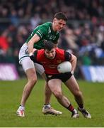 19 April 2025; Peter Fegan of Down in action against Conor McGee of Fermanagh during the Ulster GAA Football Senior Championship quarter-final match between Fermanagh and Down at Brewster Park in Enniskillen, Fermanagh. Photo by Ramsey Cardy/Sportsfile