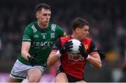 19 April 2025; Pat Havern of Down in action against Joe McDade of Fermanagh during the Ulster GAA Football Senior Championship quarter-final match between Fermanagh and Down at Brewster Park in Enniskillen, Fermanagh. Photo by Ramsey Cardy/Sportsfile
