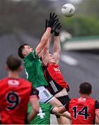 19 April 2025; Joe McDade of Fermanagh in action against Odhran Murdock of Down during the Ulster GAA Football Senior Championship quarter-final match between Fermanagh and Down at Brewster Park in Enniskillen, Fermanagh. Photo by Ramsey Cardy/Sportsfile
