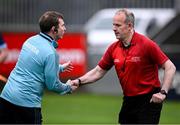 19 April 2025; Dublin manager Niall Ó Ceallacháin and referee Johnny Murphy shake hands before the Leinster GAA Hurling Senior Championship Round 1 match between Dublin and Offaly at Parnell Park in Dublin. Photo by Ray McManus/Sportsfile